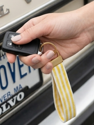 Handmade Seaside Goldenrod key fob with clean yellow and white stripes and gold hardware