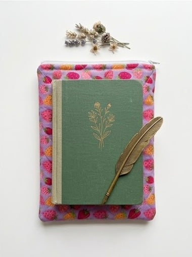 Purple book pouch with strawberry pattern on a white background